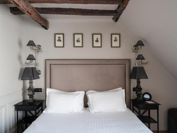 Hotel Saint-Louis en L'Isle - Notre-Dame : photo 1 de la chambre chambre double ou lits jumeaux de luxe - dernier Étage