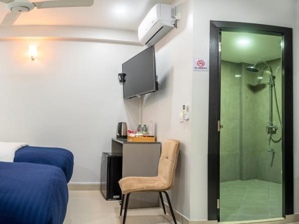 Tour Inn : photo 2 de la chambre chambre deluxe double ou lits jumeaux