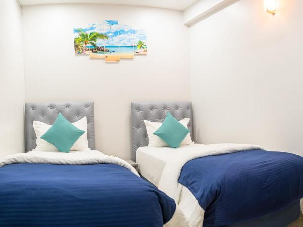 Tour Inn : photo 1 de la chambre chambre deluxe double ou lits jumeaux