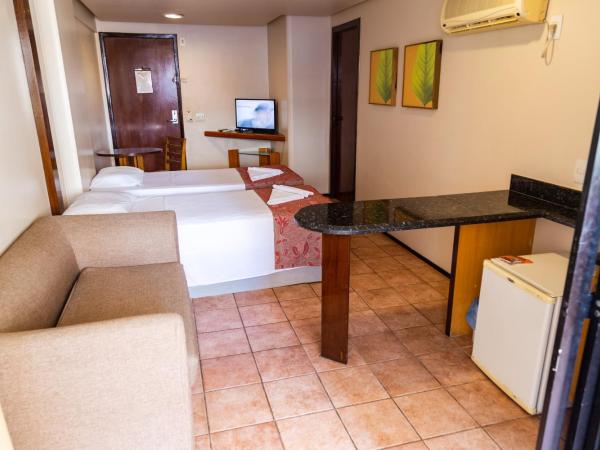 Plaza Praia Suítes : photo 4 de la chambre chambre quadruple de luxe