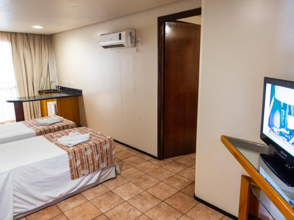 Plaza Praia Suítes : photo 5 de la chambre chambre quadruple de luxe