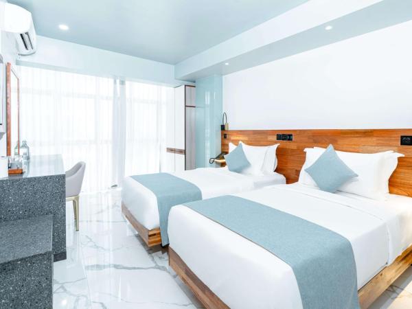 Marukab Plaza : photo 3 de la chambre deluxe twin room (free return airport transport)