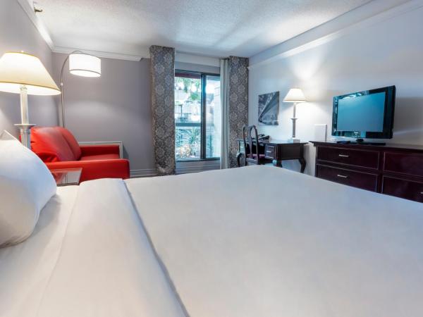 Hôtel Québec Inn : photo 2 de la chambre chambre lit queen-size traditionnelle avec balcon intérieur côté jardin