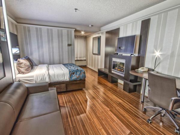 Hôtel Québec Inn : photo 2 de la chambre chambre moderne avec lit queen-size, lit queen-size escamotable et cheminée - vue sur intérieur