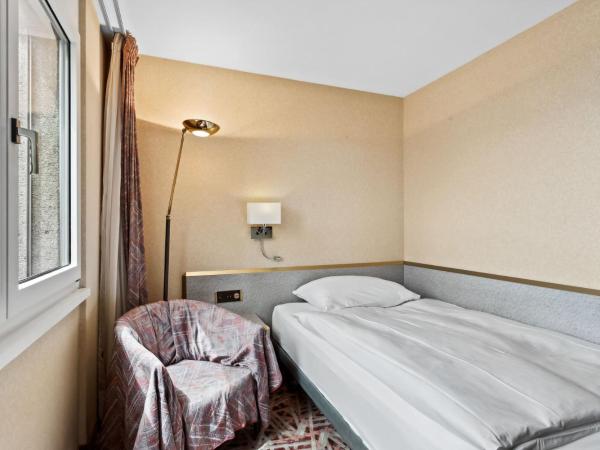 becozy Au Parc Retro Edition Self-Check-In Rooms & Studios Fribourg : photo 1 de la chambre chambre simple