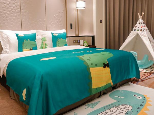 Wyndham Qingdao : photo 2 de la chambre 1 king bed, theme room, tyrannosaurus rex