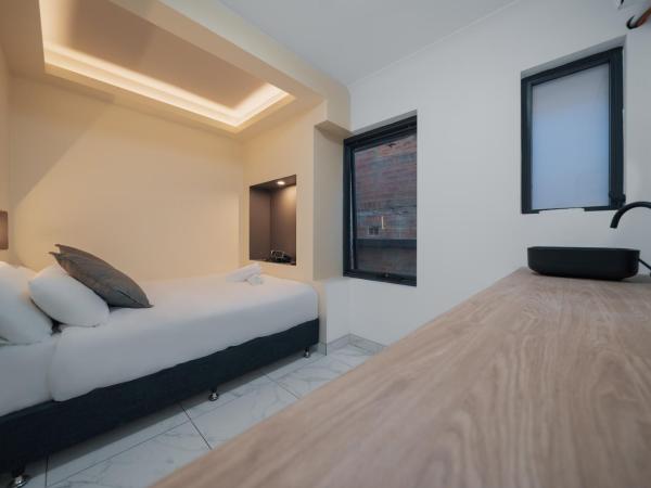 Cozy M Hotel : photo 7 de la chambre chambre lit queen-size de luxe avec salle de bains commune