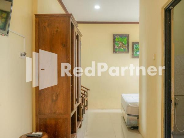 Vandhela Homestay Syariah Mitra RedDoorz : photo 2 de la chambre chambre double standard