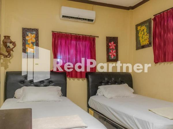 Vandhela Homestay Syariah Mitra RedDoorz : photo 4 de la chambre chambre lits jumeaux