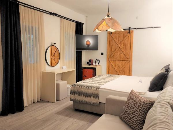 Dolce Vita Luxury Bungalows : photo 6 de la chambre maison en pierre avec cheminée