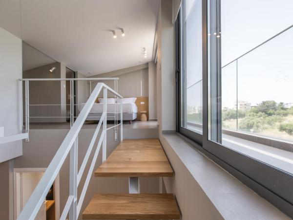 Noemie Luxury Suites : photo 7 de la chambre suite deluxe avec baignoire spa