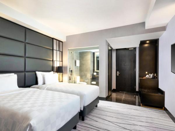 Grand Swiss-Belhotel Darmo : photo 3 de la chambre chambre lits jumeaux deluxe