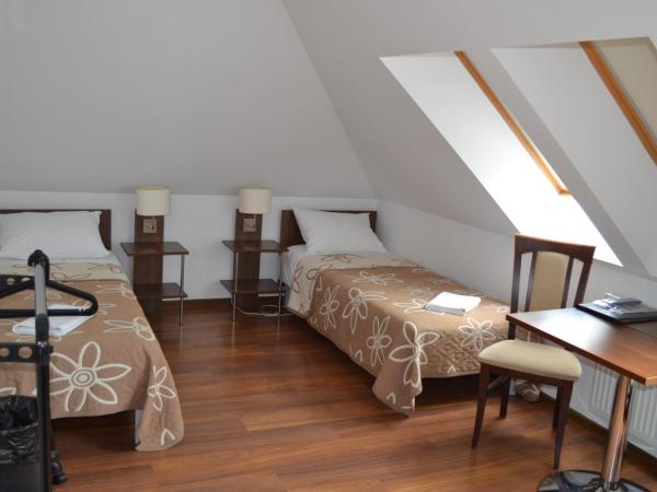 Kalinowy Sen : photo 1 de la chambre chambre triple avec salle de bains commune