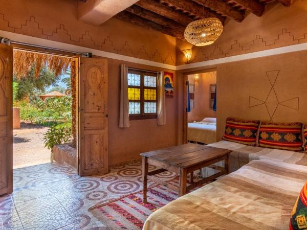 Ecolodge La Palmeraie : photo 2 de la chambre studio avec vue sur jardin