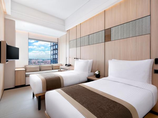 Harbour Plaza Metropolitan Shanghai : photo 1 de la chambre chambre lits jumeaux deluxe