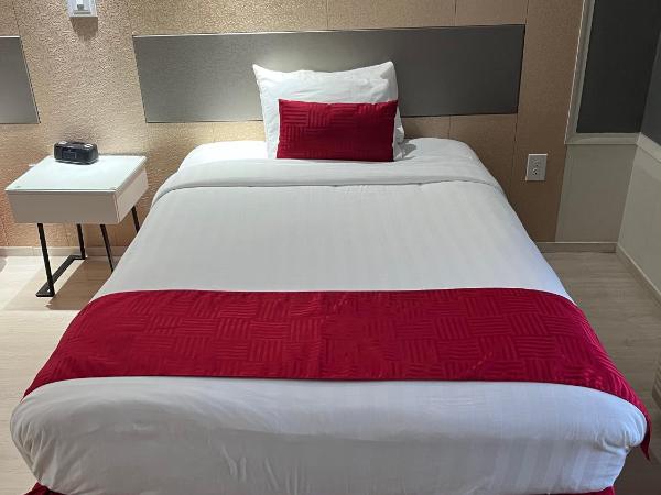Travelodge by Wyndham Orlando at Heart of International Drive : photo 9 de la chambre chambre double avec 2 lits doubles - non-fumeurs