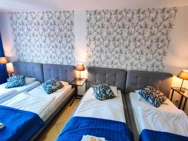Great Polonia Wrocław City Center : photo 8 de la chambre chambre quadruple