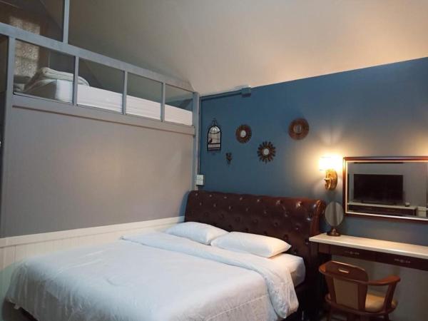 Baan JaoKorKluay บ้านเจ้ากอกล้วย : photo 8 de la chambre chambre lit king-size - vue sur jardin