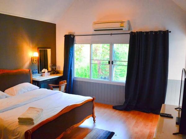 Baan JaoKorKluay บ้านเจ้ากอกล้วย : photo 1 de la chambre chambre lit king-size - vue sur jardin
