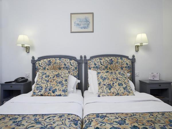 Kyriad Saumur Hyper Centre Hôtel Appartements et SPA soins Sothys Paris : photo 1 de la chambre chambre double confort