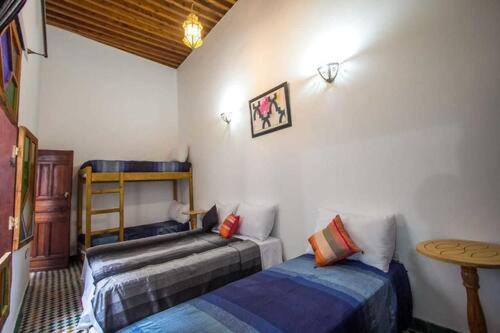 DAR MILOUDA RCIF : photo 1 de la chambre chambre familiale avec baignoire