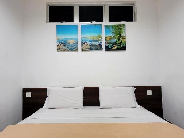 Api-Api GuestHouse : photo 4 de la chambre chambre lit king-size deluxe