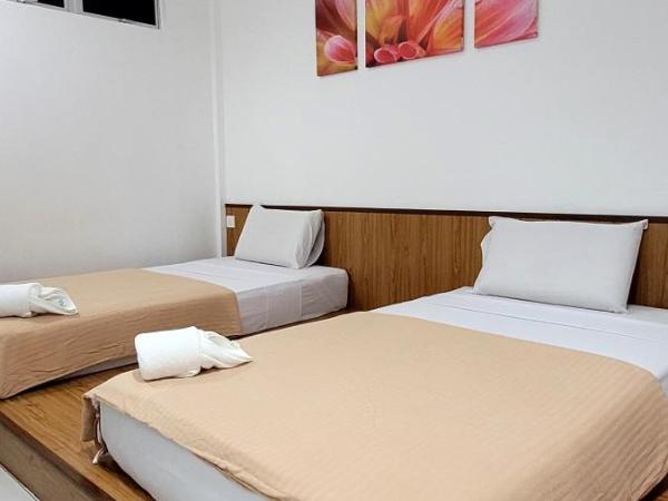 Api-Api GuestHouse : photo 9 de la chambre chambre lits jumeaux standard