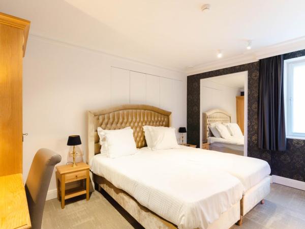 Golden Tree Hotel : photo 3 de la chambre chambre lits jumeaux