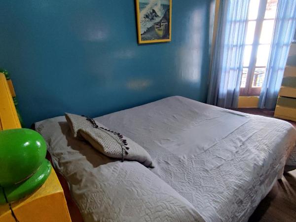 Hostel Ruca Potu : photo 1 de la chambre chambre quadruple avec salle de bains commune