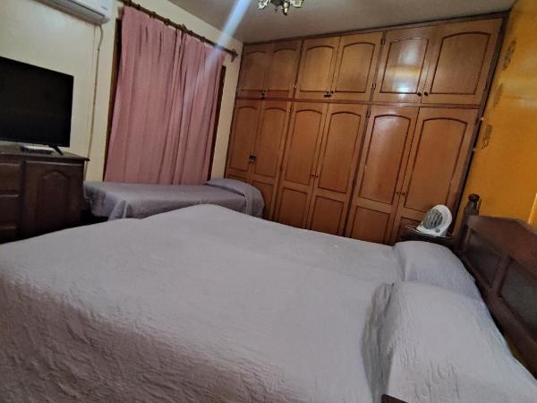 Hostel Ruca Potu : photo 1 de la chambre chambre triple avec salle de bains privative