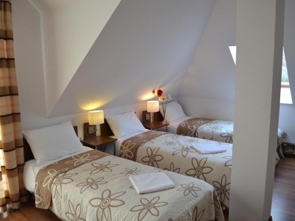 Kalinowy Sen : photo 2 de la chambre chambre triple avec salle de bains commune