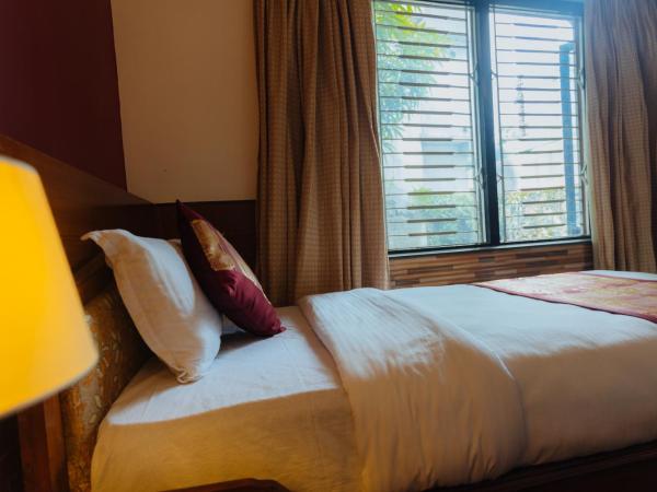 Hotel Tulsi : photo 9 de la chambre chambre familiale