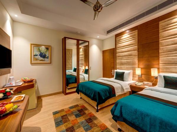 The Astor : photo 2 de la chambre chambre deluxe double ou lits jumeaux