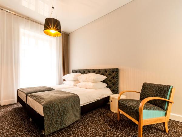 Sleep in Hostel & Apartments Stary Rynek : photo 1 de la chambre chambre deluxe double ou lits jumeaux