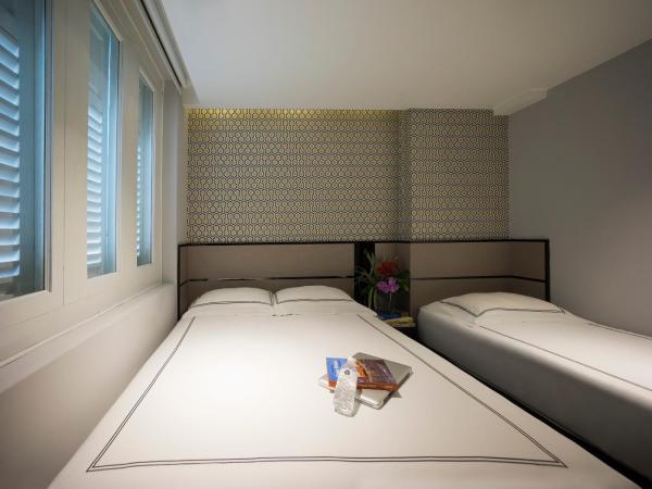 Venue Hotel The Lily : photo 1 de la chambre chambre triple