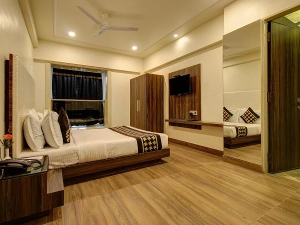 Hotel Mumbai House Juhu, Santacruz West, Mumbai : photo 2 de la chambre chambre lit king-size