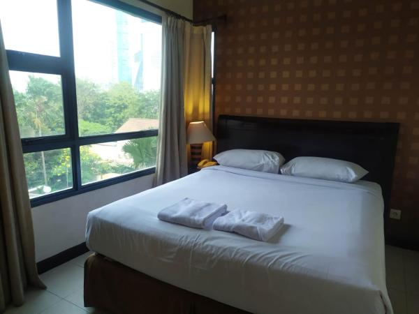 Grand Tropic Suites Hotel : photo 1 de la chambre suite affaires