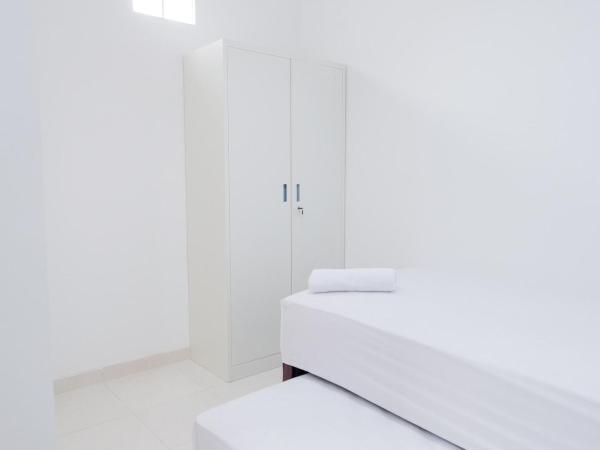 KoolKost near Jalan Veteran Raya (Minimum Stay 6 Nights) : photo 9 de la chambre chambre lits jumeaux