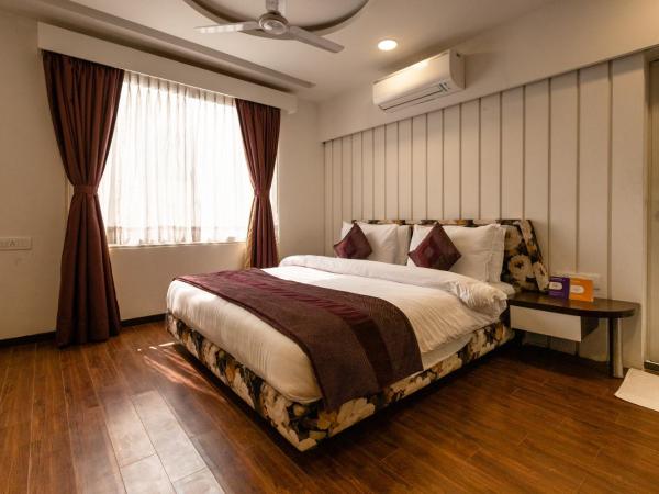 3 BY OYO Nami Residency Ahmedabad : photo 1 de la chambre chambre triple confort avec douche