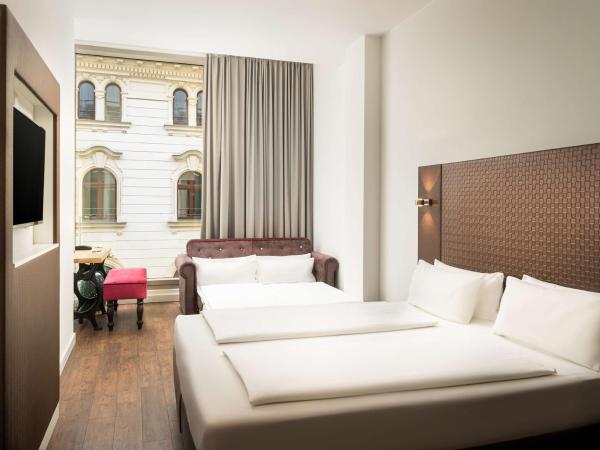 elaya hotel leipzig city center : photo 6 de la chambre chambre triple standard