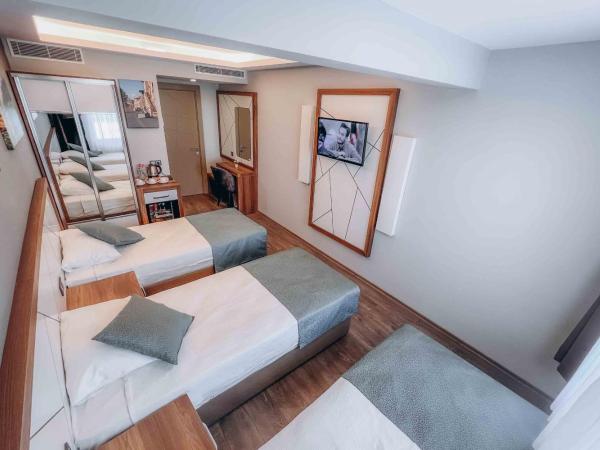 Hakcan Hotel : photo 5 de la chambre chambre triple