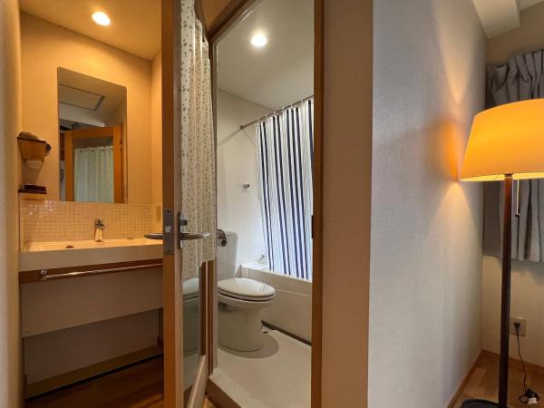 Guesthouse Soi : photo 4 de la chambre chambre lit queen-size avec canapé-lit