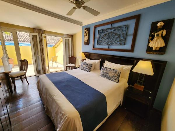 Hotel Casa do Amarelindo : photo 1 de la chambre chambre supérieure avec balcon