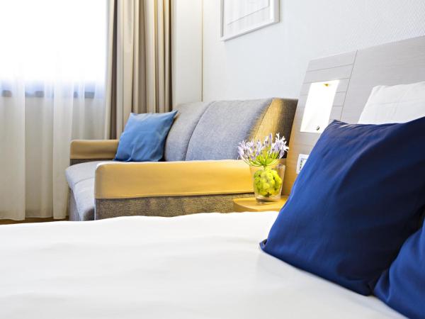 Novotel Genova City : photo 8 de la chambre chambre double standard avec canapé-lit