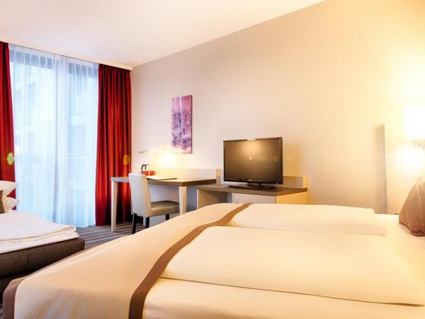 Leonardo Hotel Hannover Airport : photo 4 de la chambre chambre familiale triple supérieure