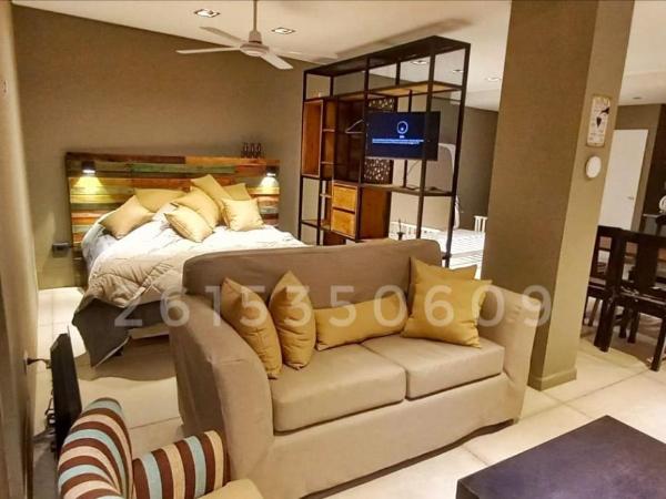 H125 - Complejo Mendoza : photo 4 de la chambre chambre familiale - vue sur jardin