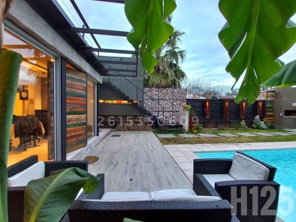 H125 - Complejo Mendoza : photo 1 de la chambre chambre familiale - vue sur jardin