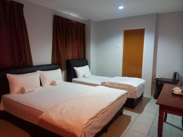 Reintree Lodge Hotel : photo 5 de la chambre chambre triple deluxe