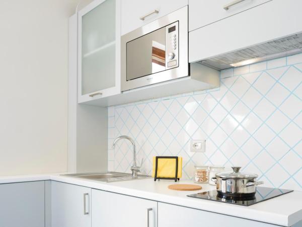 Il Papavero Residence Arbostella : photo 5 de la chambre appartement 1 chambre supérieur avec balcon