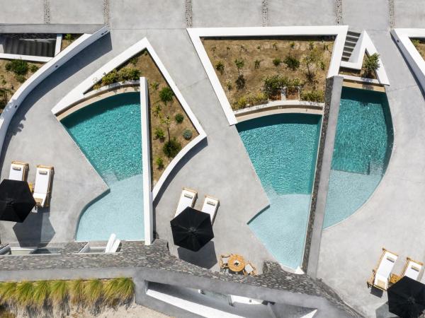 Santo Pure Oia Suites & Villas : photo 1 de la chambre suite junior troglodyte avec piscine